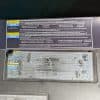 GMT800 AC refrigerant information label (R-134a)—new reproduction next to OEM decal on 2002 Chevrolet Tahoe shroud