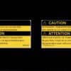 Flat scan of GM 12565610 transfer case caution and 12567697 AWD warning label reproductions