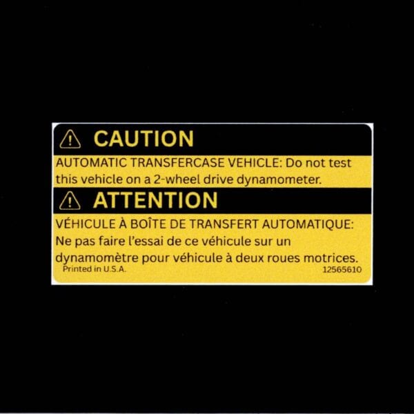 Straight-on scan of GM 12565610 NP8 transfer case caution label reproduction in English and French