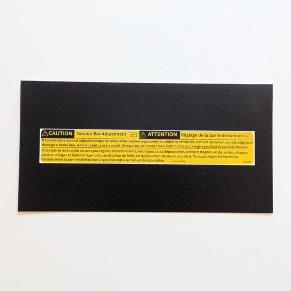 GMT Central reproduction of GM 15772975 bilingual front torsion bar adjustment warning label
